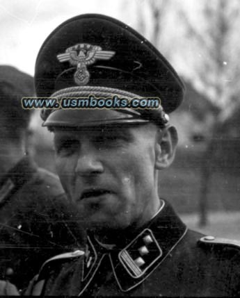 NSKK-Sturmhauptführer with the beautiful Schirmmütze or visor cap is identified as H. Schobert.